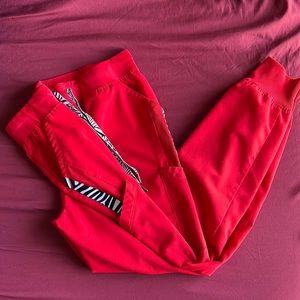 Grey’s Anatomy Red zebra accented jogger scrub pants.